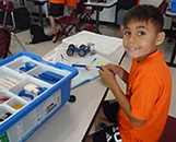 KOC student assembling a car