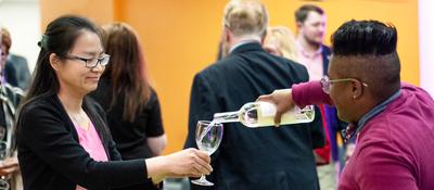 wine being poured for vino scholastico attendee