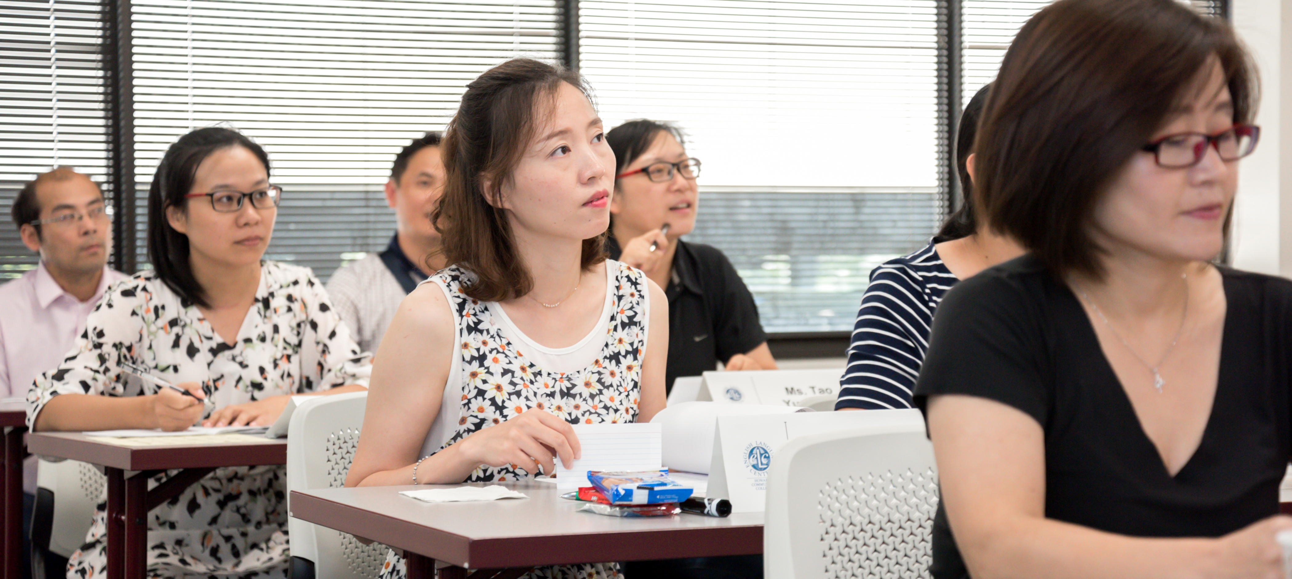 Several women in a classroom setting