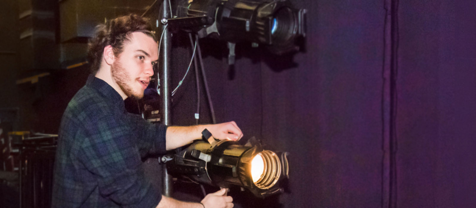 Student adjusting lighting