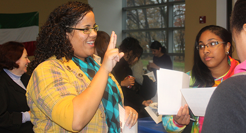 a student practicing ASL
