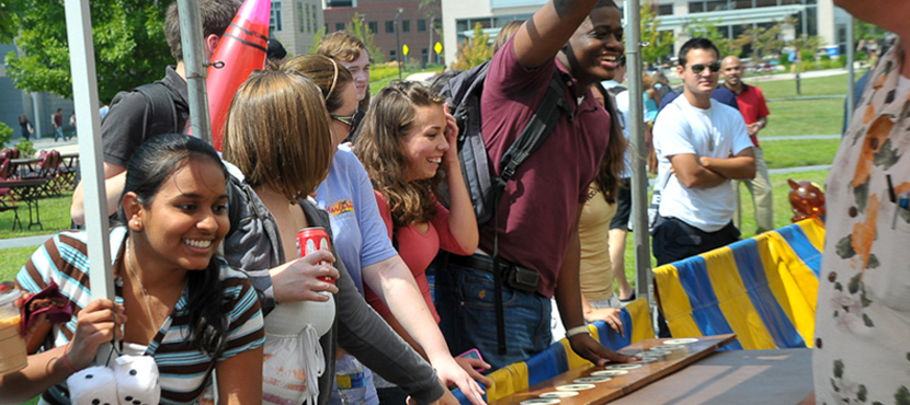 Students playing carnival games at Spring Fling